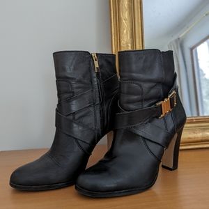 Vince Camuto black leather boots with gold accents